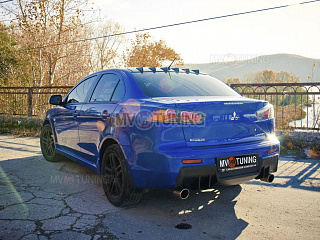 Накладка на задний бампер в стиле EVO Текстурный пластик var №2 Mitsubishi Lancer X (2007-2016)